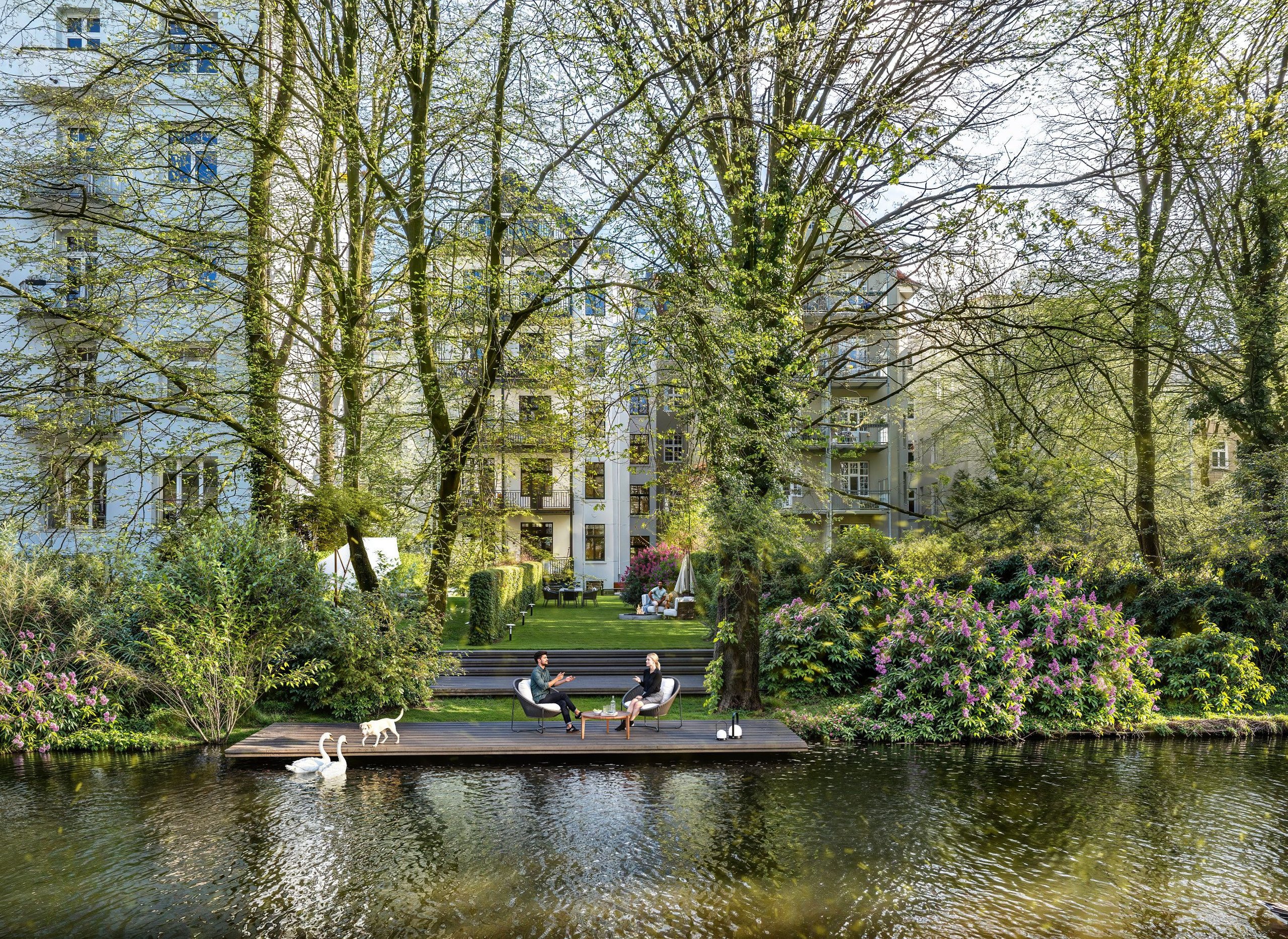 Aerial 3D view of the Andreasstraße back garden, displaying a well-designed outdoor space with dining and relaxation areas surrounded by greenery.